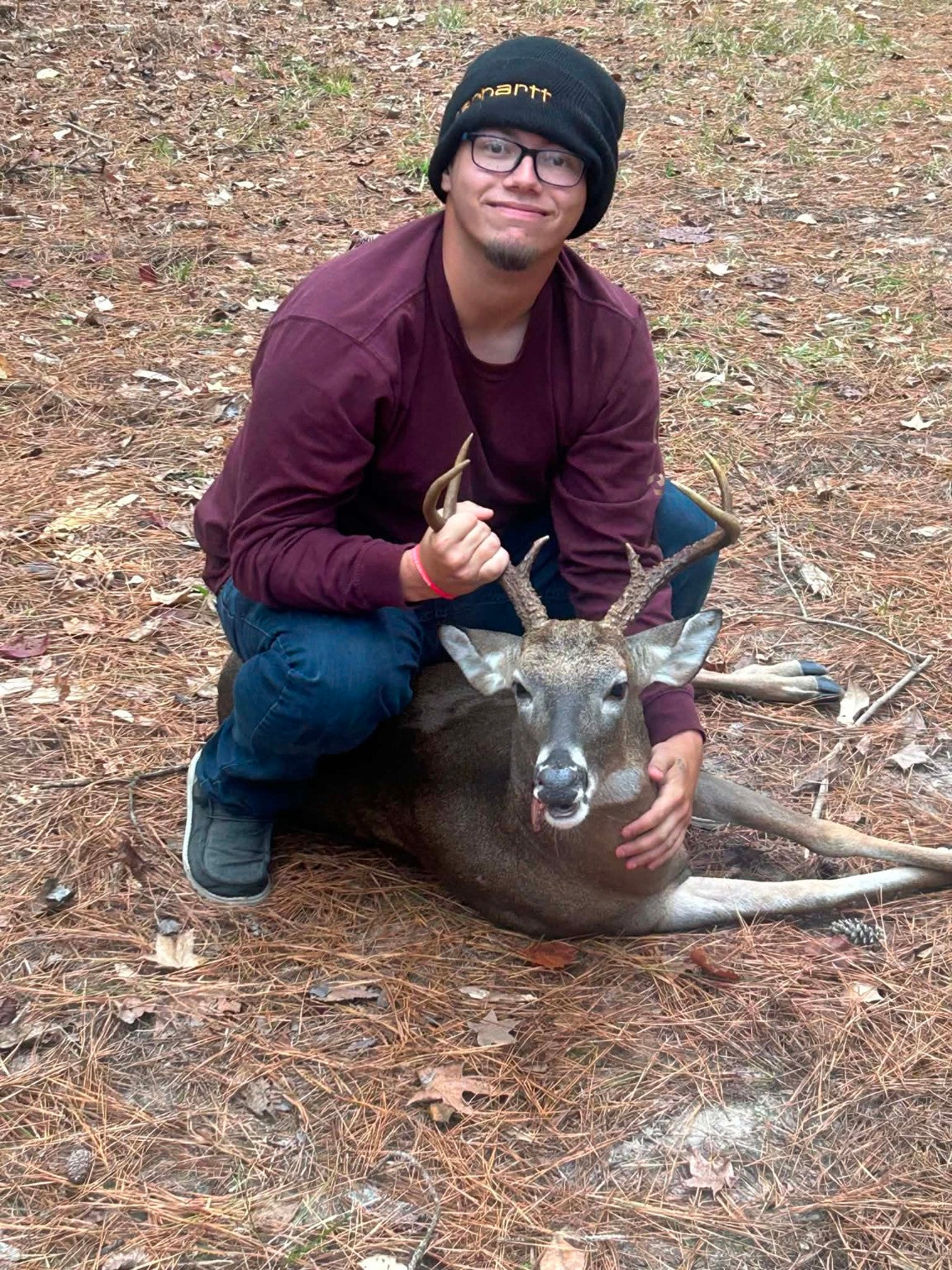 Nathan Deville with his eight-point buck